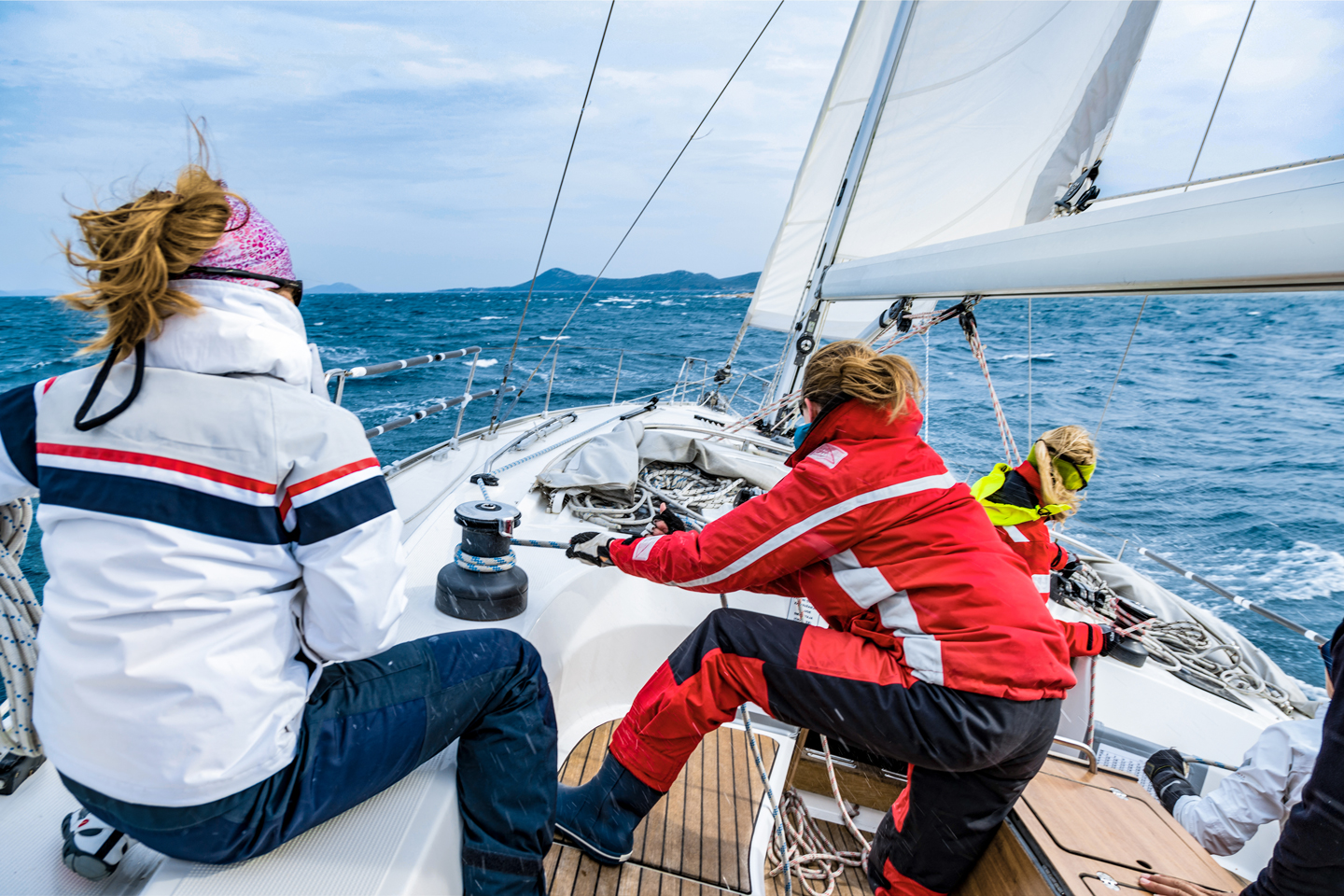 Sailors on deck powered by Fischer Panda marine generator at sea