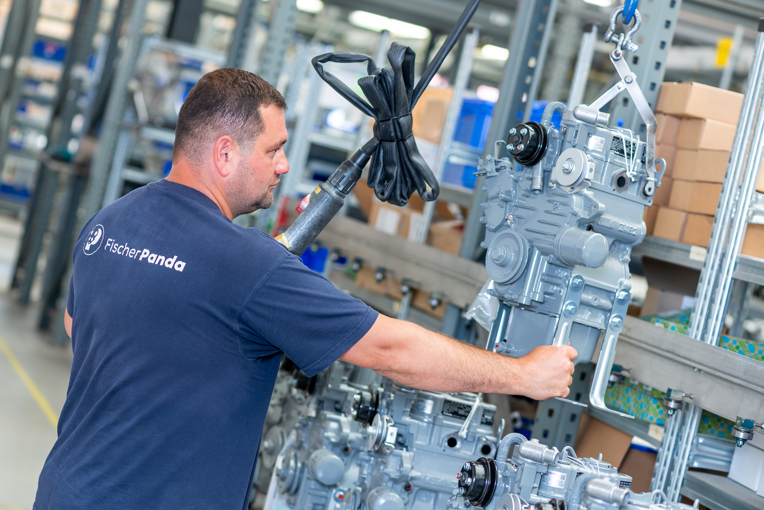 Fischer Panda engineer assembling mobile generator in production facility
